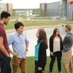 Picture of students standing next to NIACC pond