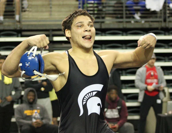 Picture of NIACC Wrestler Jose Valdez celebrating after national championship victory